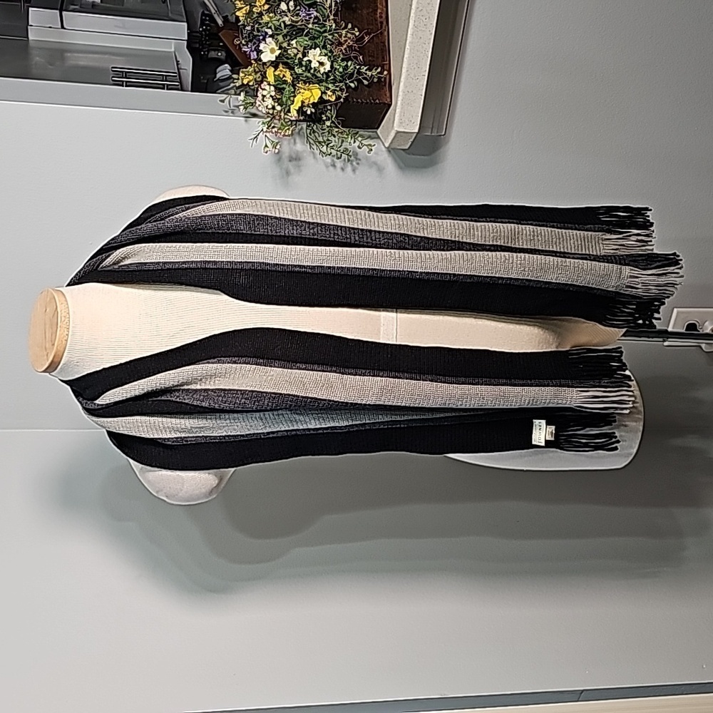 Scarf gray and black striped with fringe. By Fownes 💯% acrylic. 10" X 60".‎